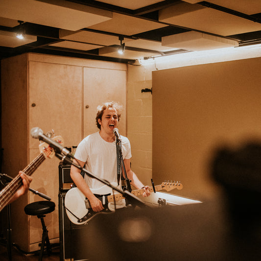 guitarist recording in studio music