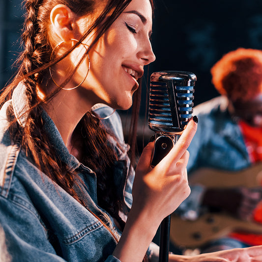 guy plays guitar girl sings african american man