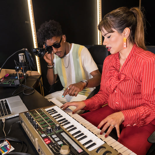 pianist recording a new song in a studio
