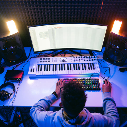 young sound producer working at studio