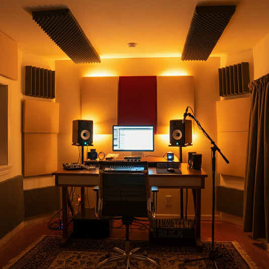 An affordable home recording studio setup in a small room with DIY acoustic treatment