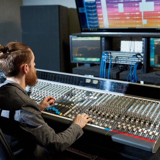 man mixing and creating music