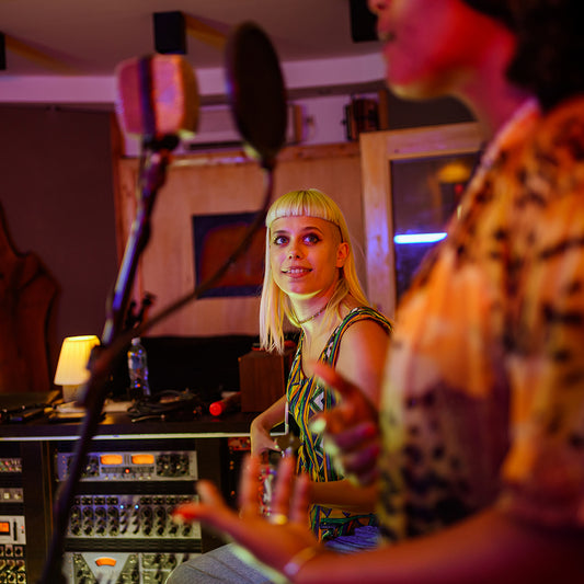 portrait of woman guitar player recording