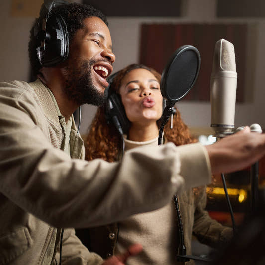 Female and male singer duo had a recording session in studio