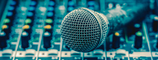 closeup microphone over the audio mixer