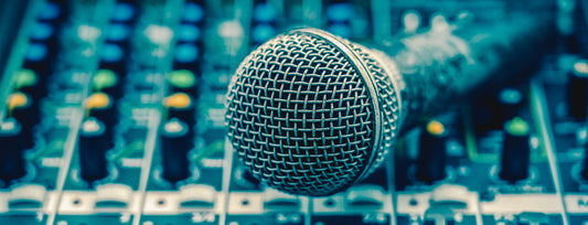 closeup microphone over the audio mixer