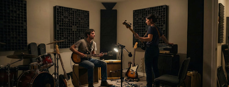 Musicians playing in a home studio optimized with FOROOMACO room acoustic treatments, experiencing perfectly flat sound