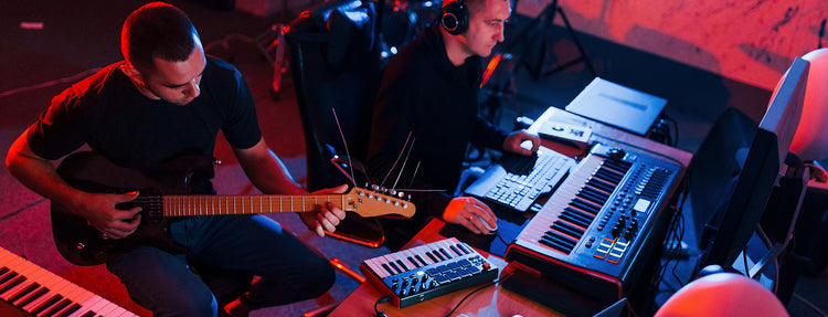 Sound engineer have recording session with guitarst